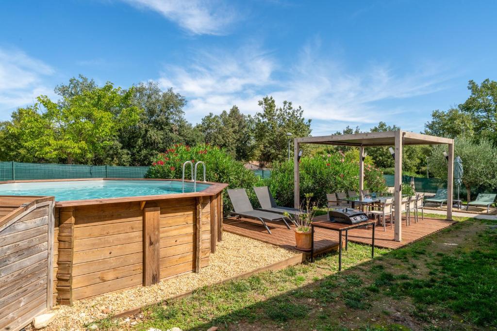 a backyard pool with a hot tub and a gazebo at Villa piscine, clim in Méjannes-le-Clap