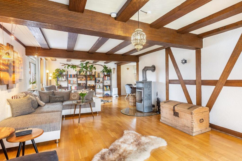 a living room with a couch and a fireplace at You R Welcome too in Frischborn