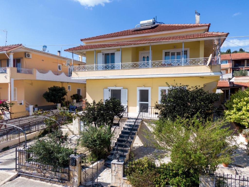 a house with stairs in front of it at Panorama House Petritis in Petrití