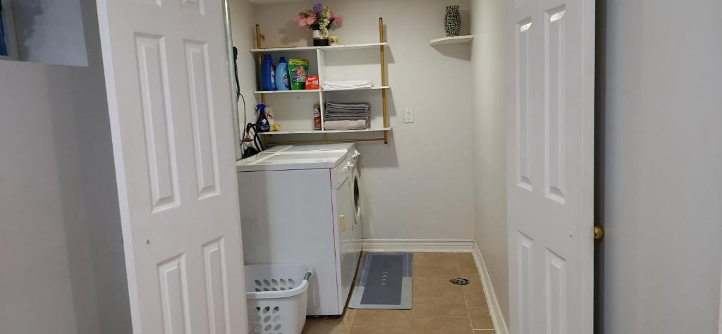 a laundry room with a washer and dryer in it at 23 Eastdale crescent in Richmond Hill