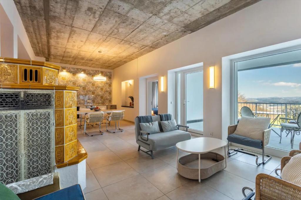 a living room with a couch and chairs and a table at Suiten im Alten Berghotel Franziska in Eslohe