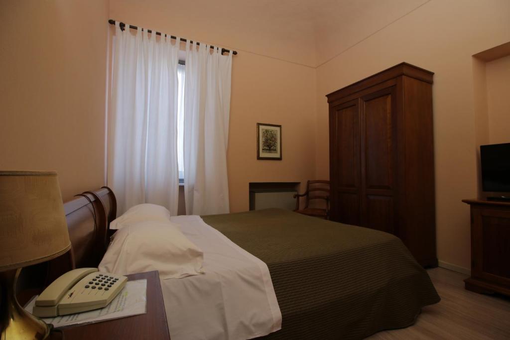 Postel nebo postele na pokoji v ubytování Il Giardinetto