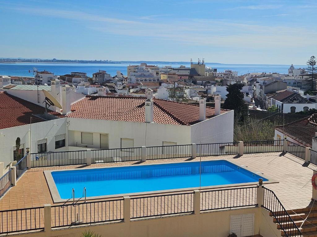 a swimming pool on the roof of a house at Your Secret in Lagos in Lagos