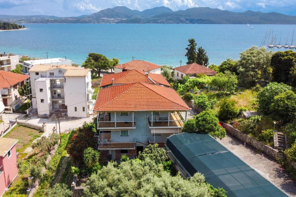 an aerial view of a house with a train in front of the water at Nikoleta Apartment A in Nikiana