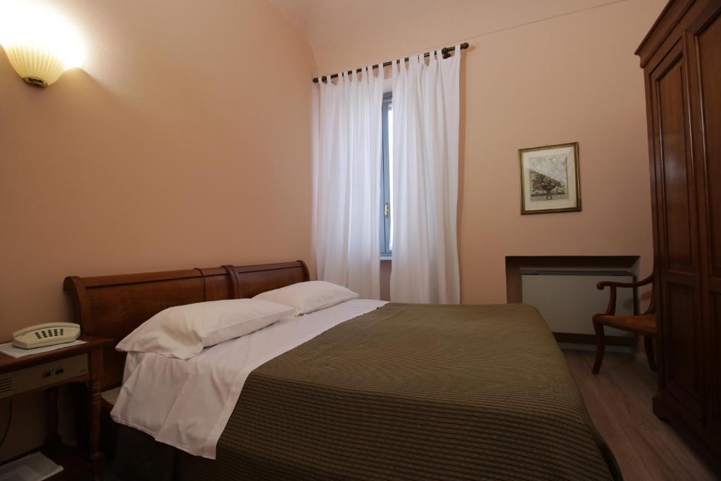 Postel nebo postele na pokoji v ubytování Il Giardinetto