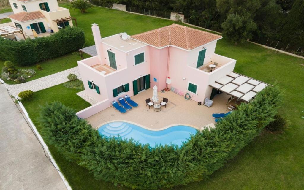 an aerial view of a house with a swimming pool at Sami Beach Villas Fedra in Sami