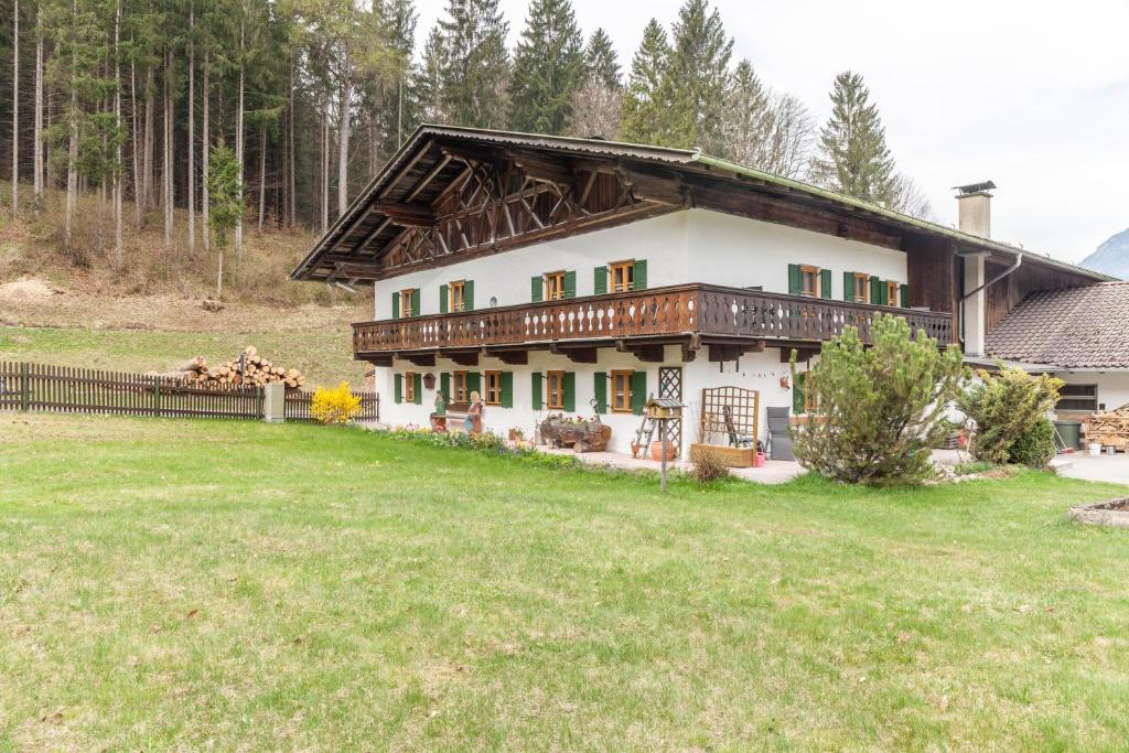a house with a large yard in front of it at Haus Niklos - Waldeck in Grainau