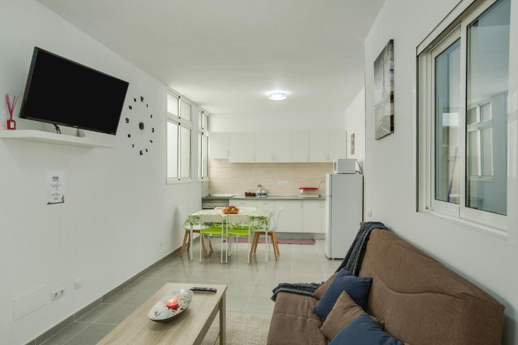 a living room with a couch and a table at 2b El Amore in Vecindario