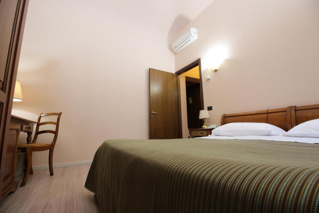 Postel nebo postele na pokoji v ubytování Il Giardinetto