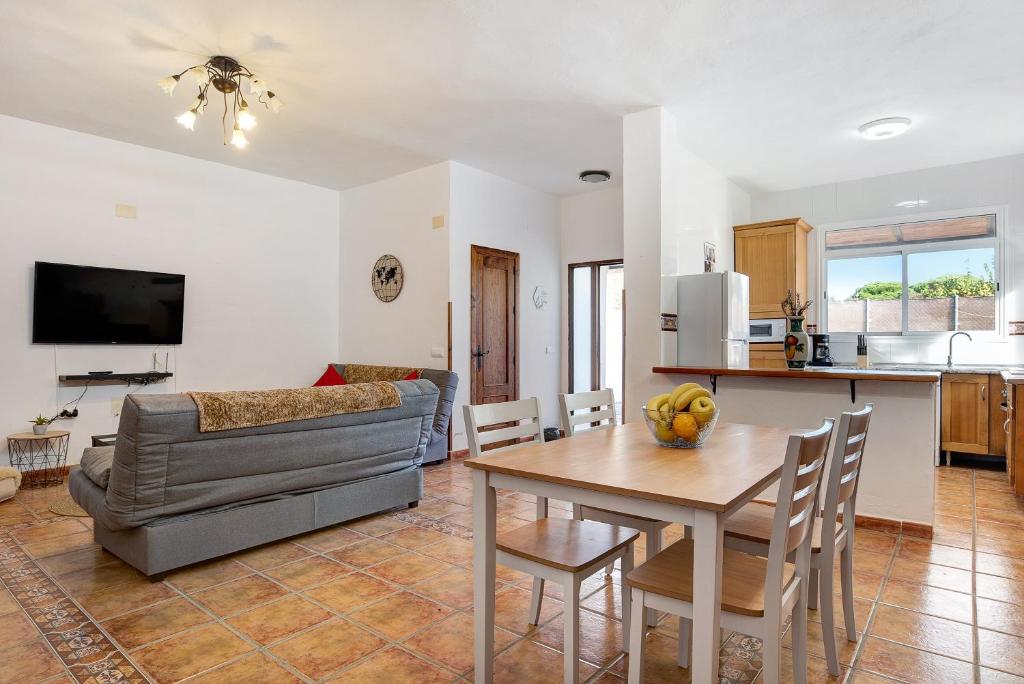 a living room with a couch and a table at Los Olivos in Barbate