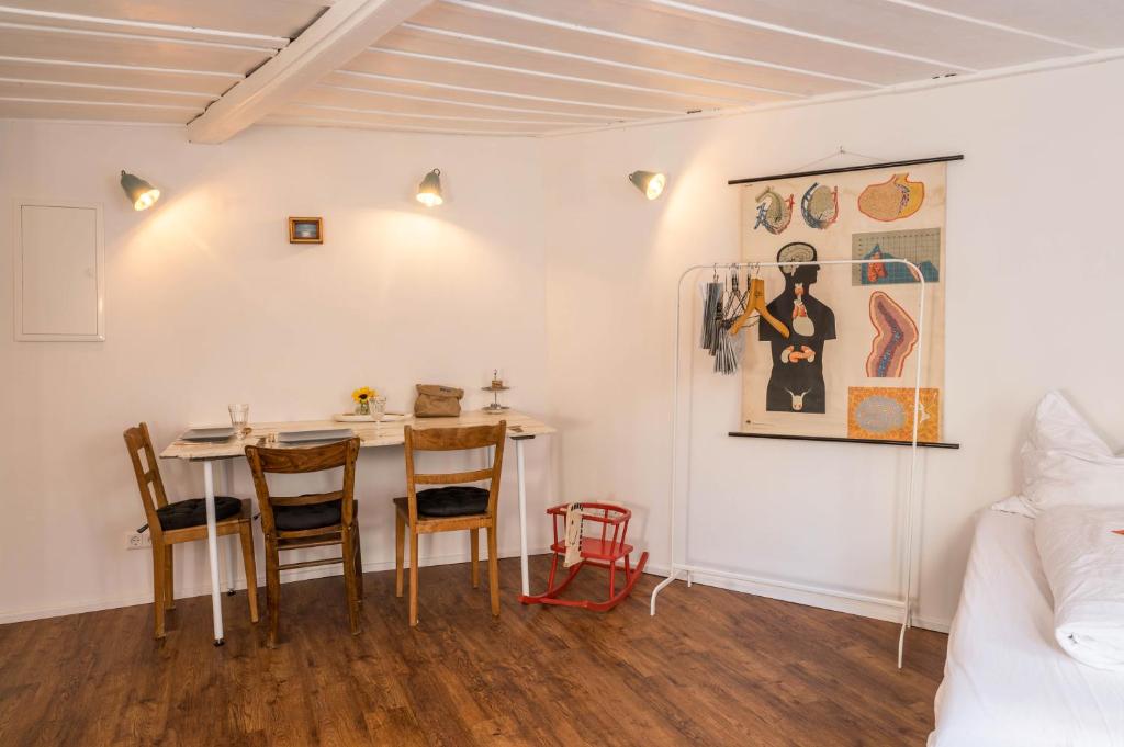 a small dining room with a table and chairs at Fewo Sankt Johann ll in Konstanz