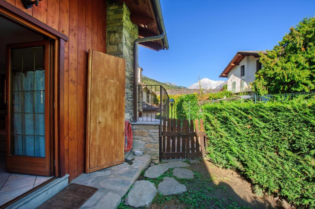 an entrance to a house with a wooden door at The Waterfall Chalet in La Salle