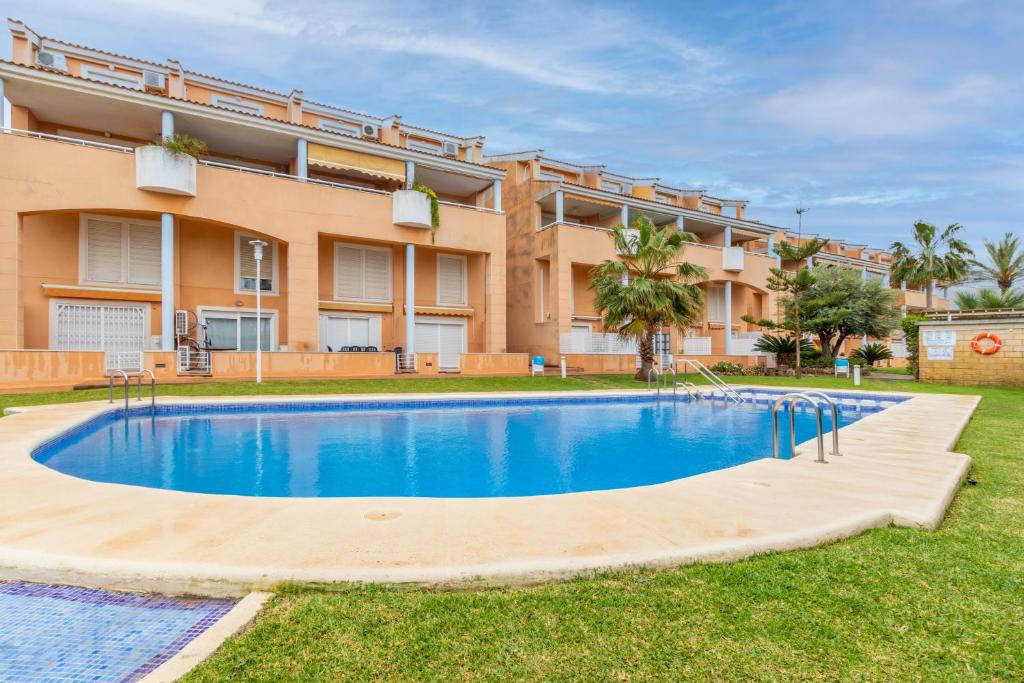 an image of a swimming pool in front of a building at Edificio Menorca in Balcon del Mar