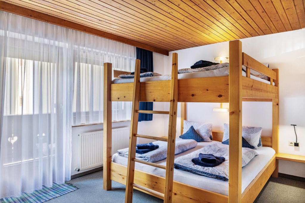 a bunk bed room with two bunk beds at Studio Hochzillertal mit Sauna in Ried im Zillertal