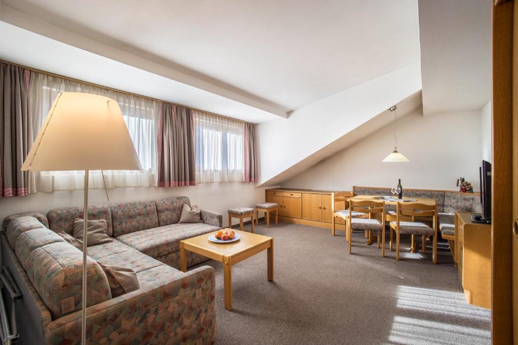 a living room with a couch and a table at Manuel's App Watschinger - Frieda in Sesto