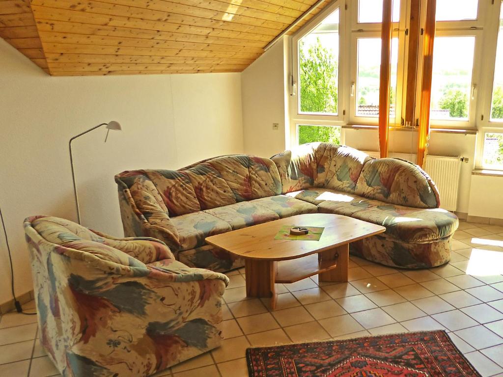 a living room with a couch and a coffee table at Haus Sonntag in Frickingen