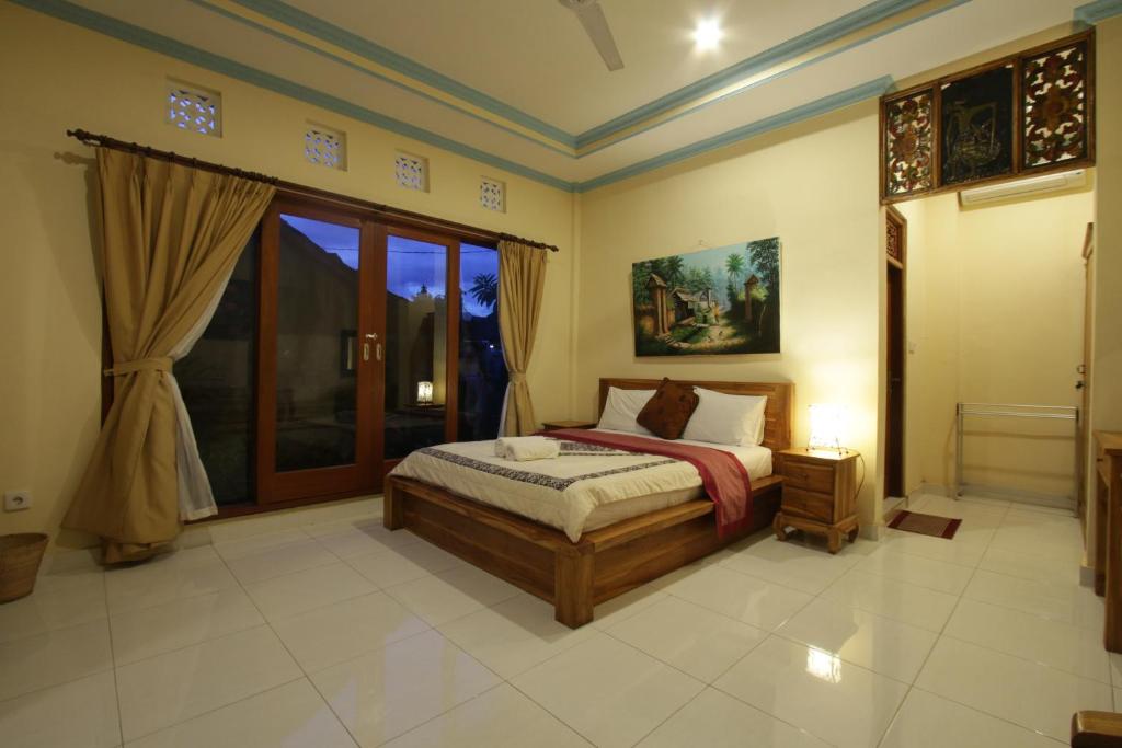 Postel nebo postele na pokoji v ubytování Loris Homestay