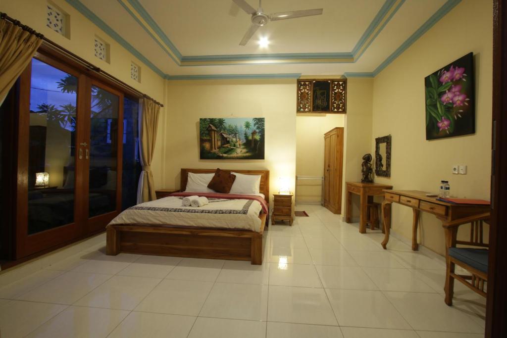 Postel nebo postele na pokoji v ubytování Loris Homestay