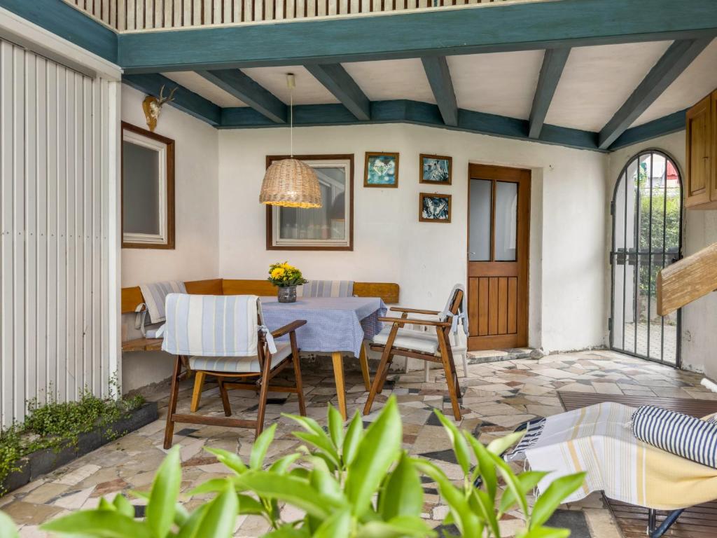 an outdoor patio with a table and chairs at Haus Kremeier in Kressbronn am Bodensee