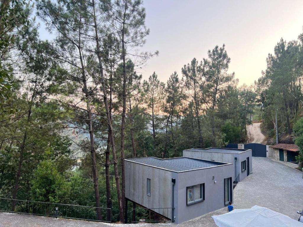 a tiny house in the woods with trees at Gerês Hideaway in Vilar da Veiga