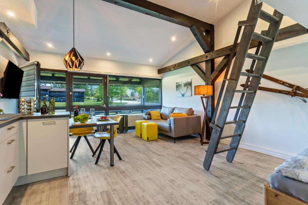 a kitchen and living room with a ladder at Feichten Glück 16 in Siegsdorf