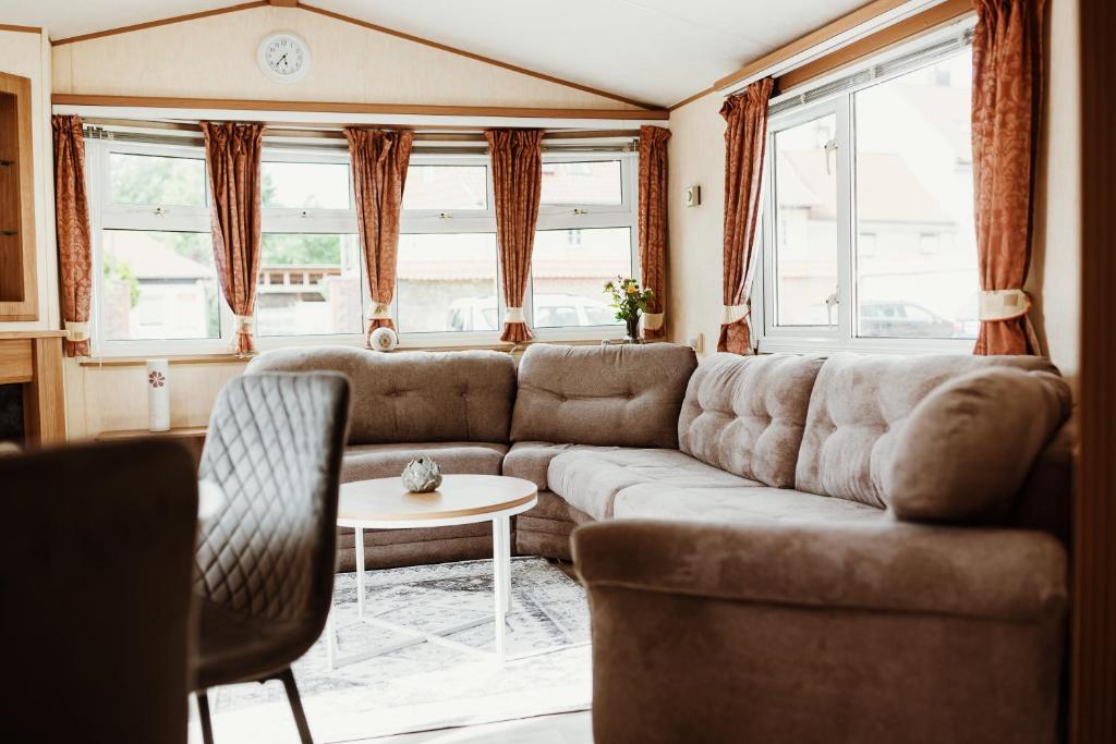 a living room with a couch and a table at Villa Hexenaltar in Thale