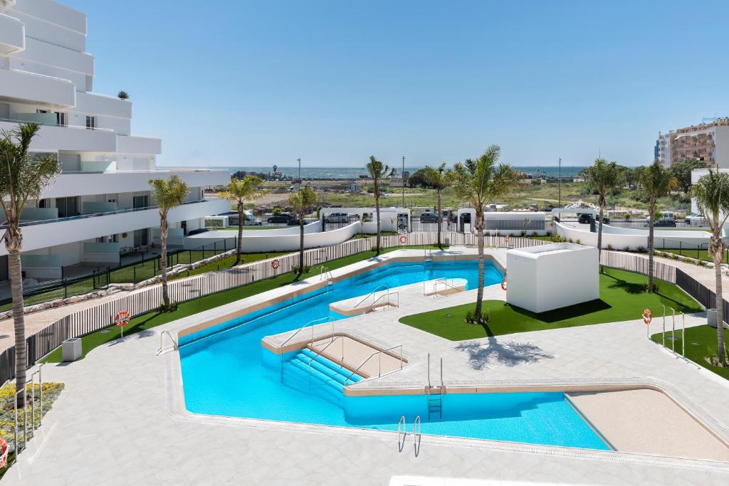 an overhead view of a swimming pool in a building at Horus 051 in Torre del Mar