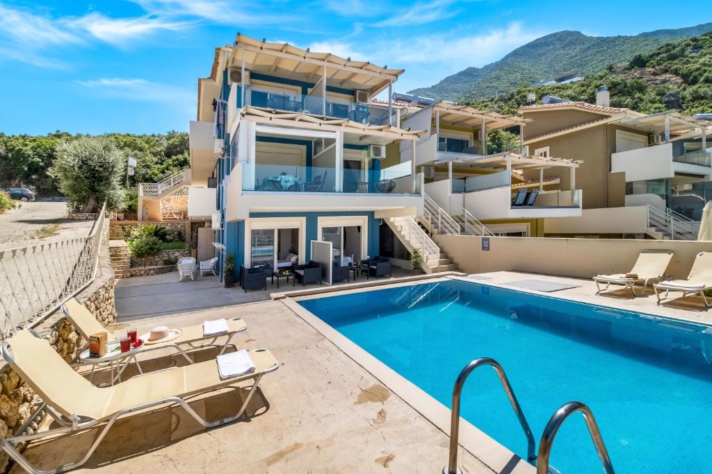 an image of a villa with a swimming pool at Oceanida Aelia Room 2 in Nikiana