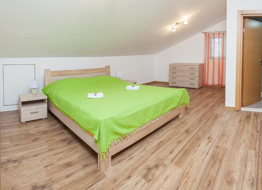 Postel nebo postele na pokoji v ubytování Apartments Viktoria