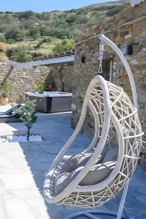 a white circular slide in front of a building at Celini Villas Tinos in Tinos