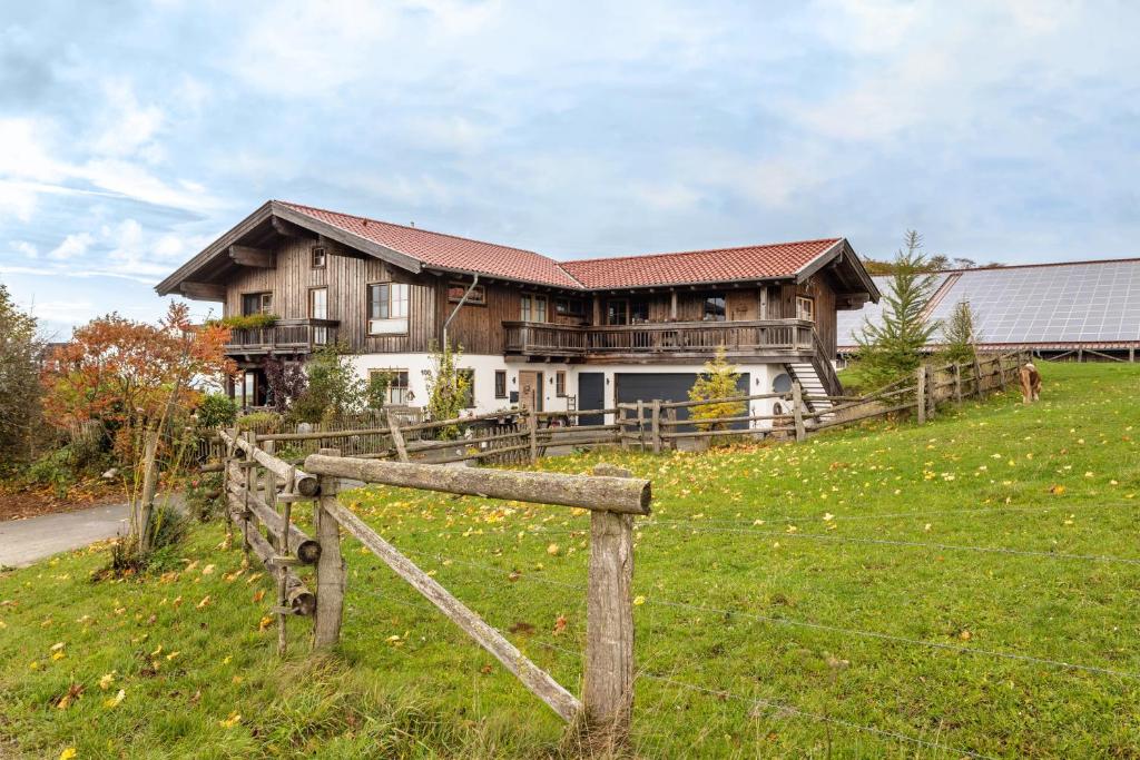 a house on a hill with a fence at Chalet Bergliebe in Brilon
