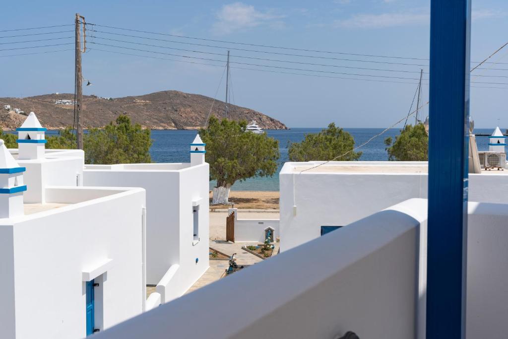 a view of the ocean from the balcony of a house at Studios Ninemia Serifos 4 in Livadi