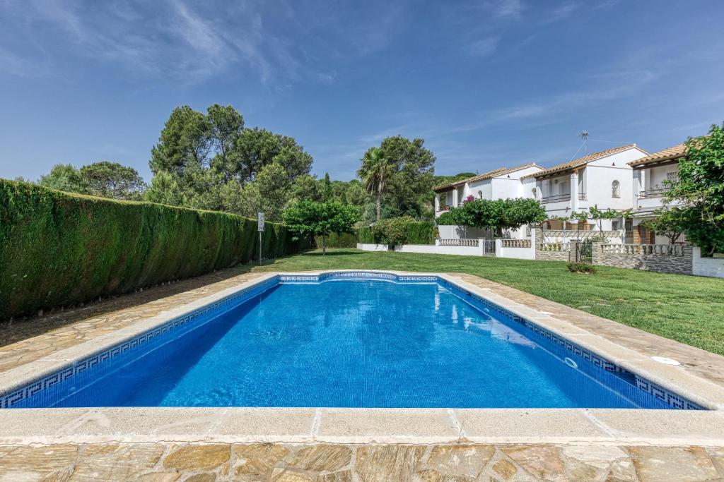 a swimming pool in the yard of a house at Casa 3 Dormitorios Con Piscina in L'Escala