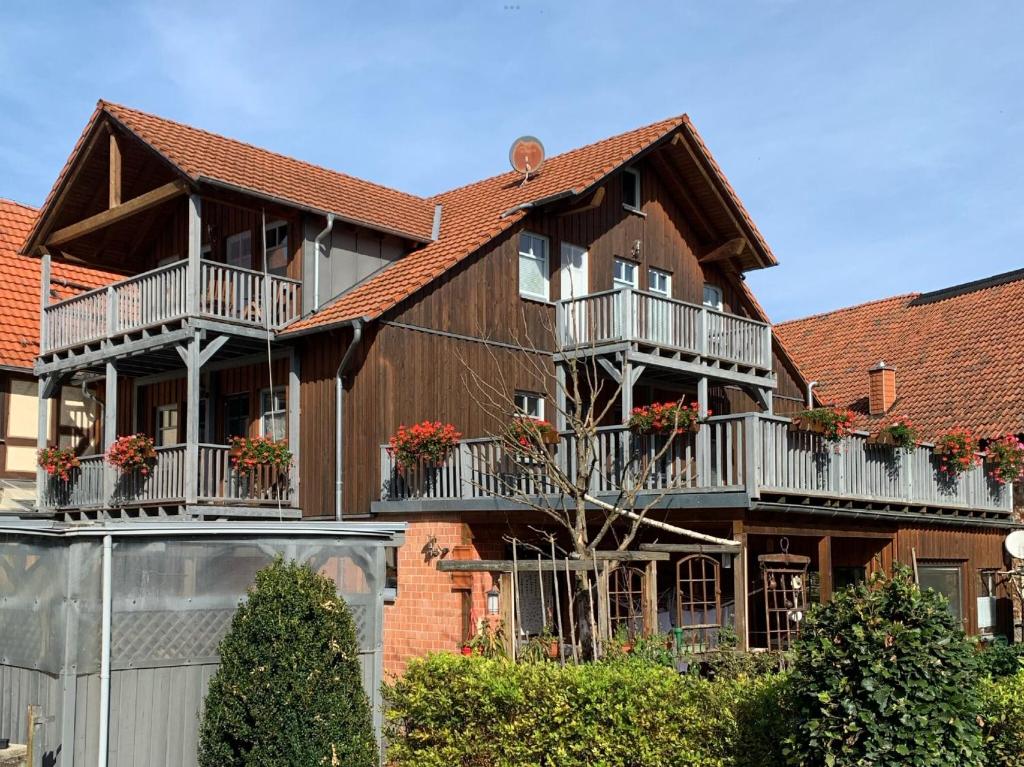 a house with balconies on the side of it at Ferienwohnung 1 Hof Schäfer in Waldeck