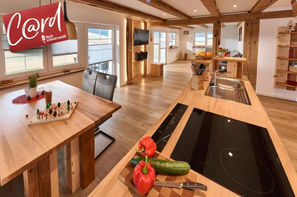 a kitchen with a counter and a counter top with a sink at Ferienhaus Wendelhof in Eisenbach
