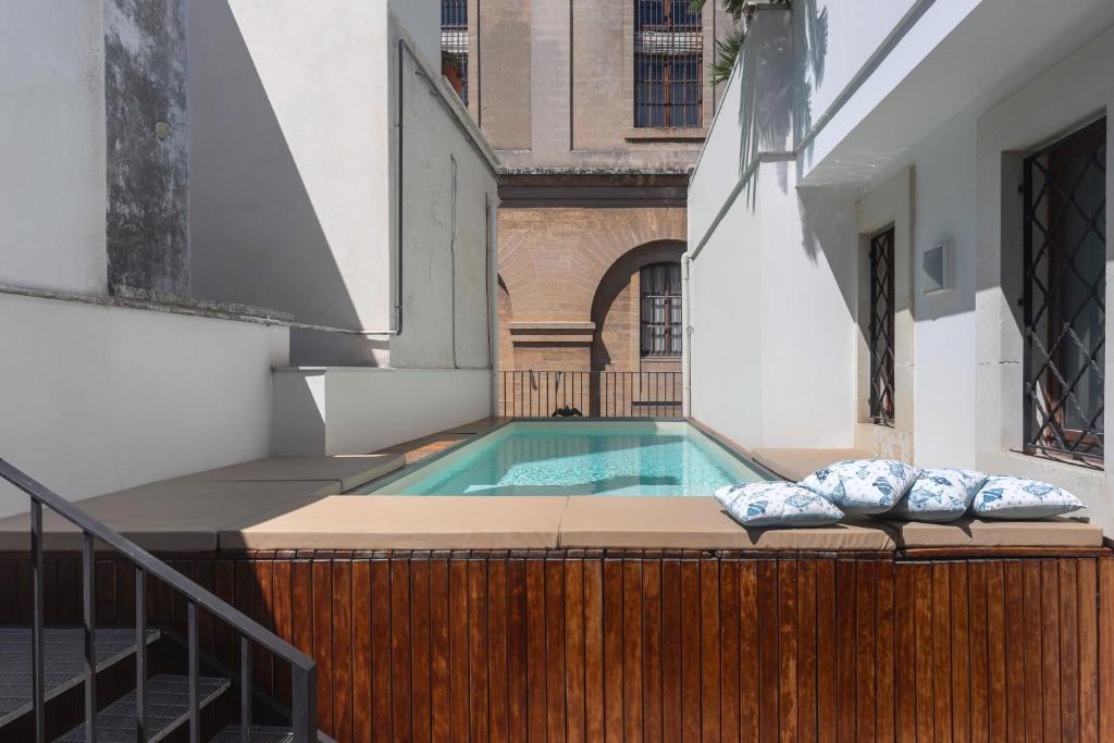 a swimming pool in the middle of a building at Palazzo P D'ajmo - Dimora Storica in Lecce