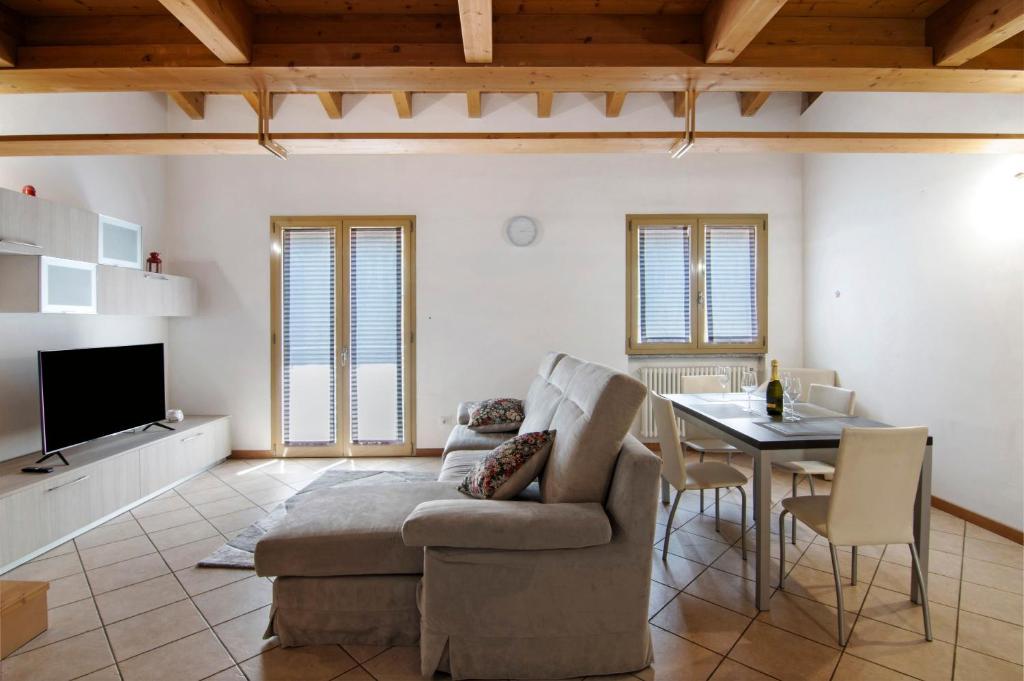 a living room with a couch and a table at Casa Zia Dani in Piantedo