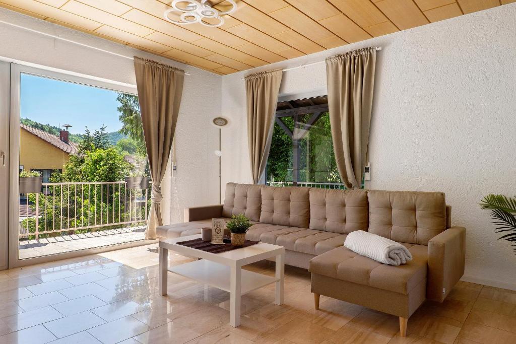 a living room with a couch and a table at Casa Conte in Mörlenbach
