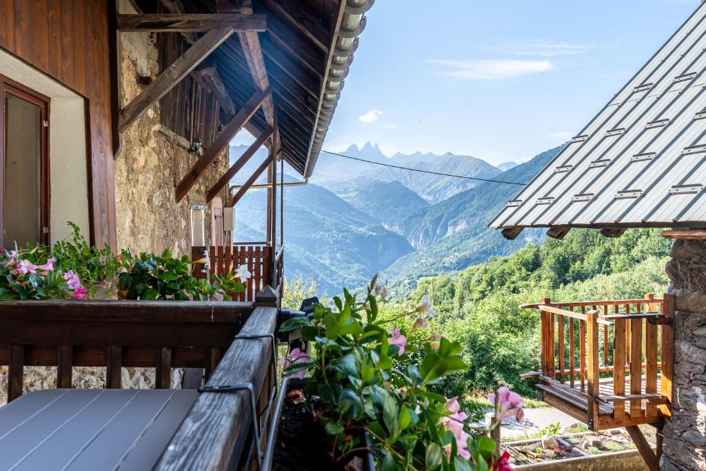 a balcony of a house with a view of mountains at L'Escampette à la Fontanette in Saint-Pancrace