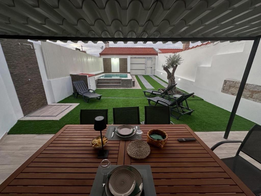 a view of a patio with a table and chairs at Casa dos Avós in Santa Eulália
