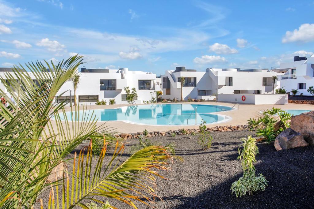 an image of a villa with a swimming pool at vv Infinity Casilla in La Oliva