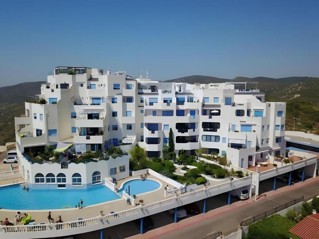 an aerial view of a large white apartment building at Perlazul in Peniscola