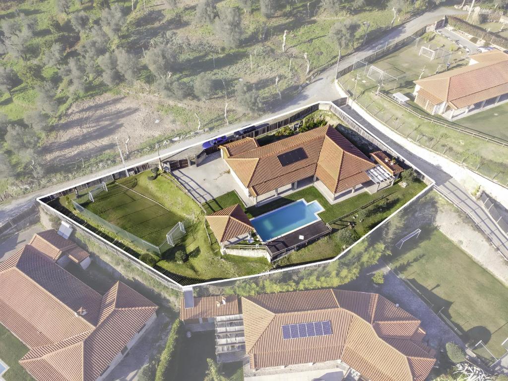 an aerial view of a house with a pool at Casa De Basto in Gémeos