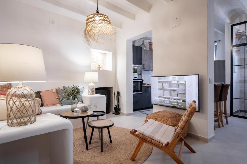 a living room with a couch and a table at Casa Roques 16 in Jávea