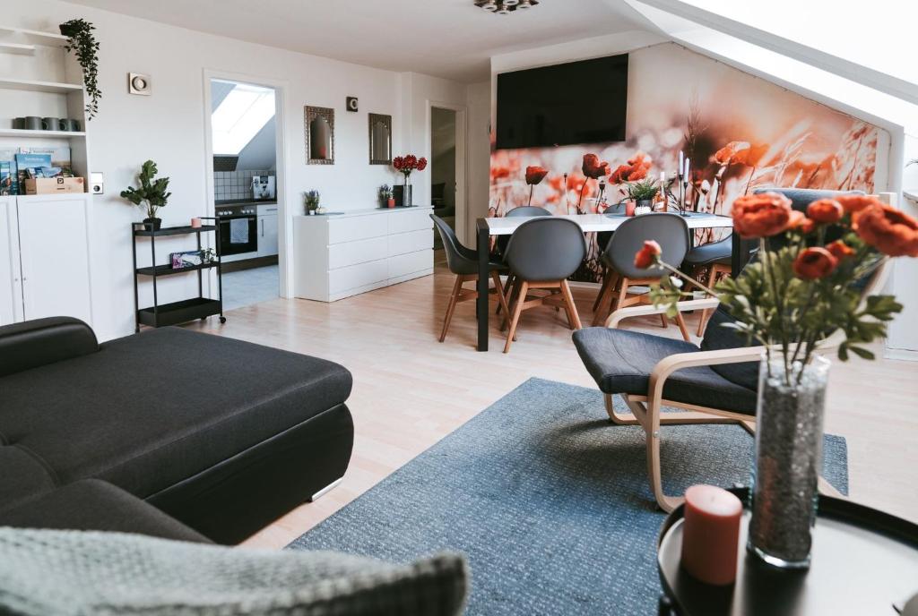 a living room with a couch and a table at Seeblick Wadee in Radolfzell am Bodensee
