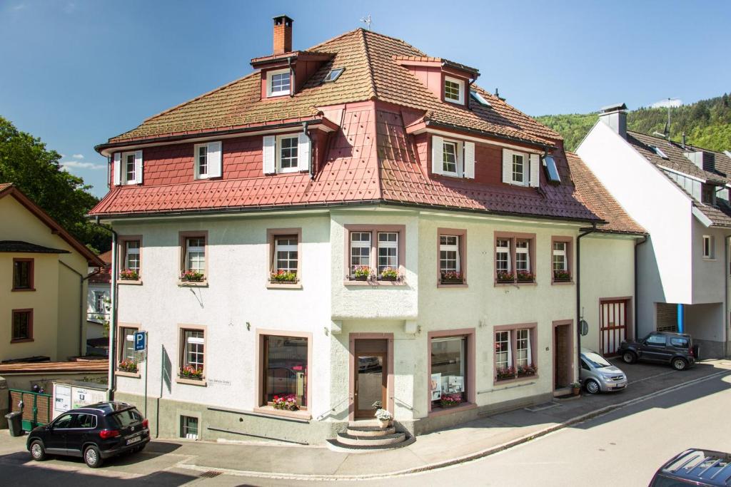a large white house with a red roof at Ferienwohnung Dietsche Todtnau in Todtnau