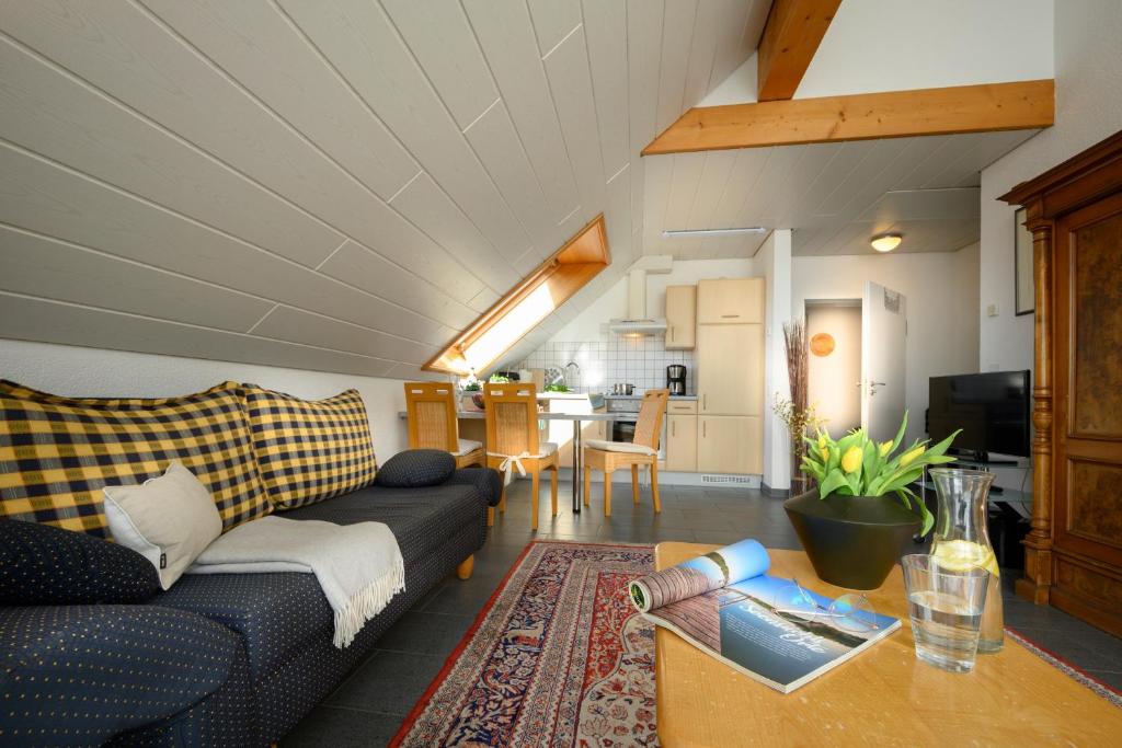 a living room with a couch and a table at Ferienwohnung Mara in Öhningen