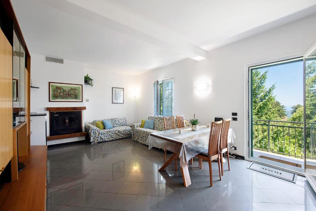 a living room with a table and a couch at Ai campi in Stella