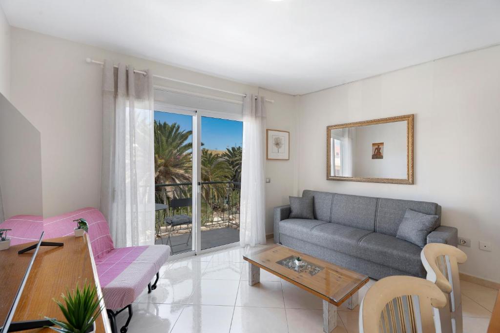 a living room with a couch and a table at Nido Andrea in San Isidro
