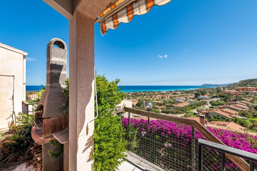 a view from the balcony of a house with purple flowers at Villa Birgit in Monte Nai